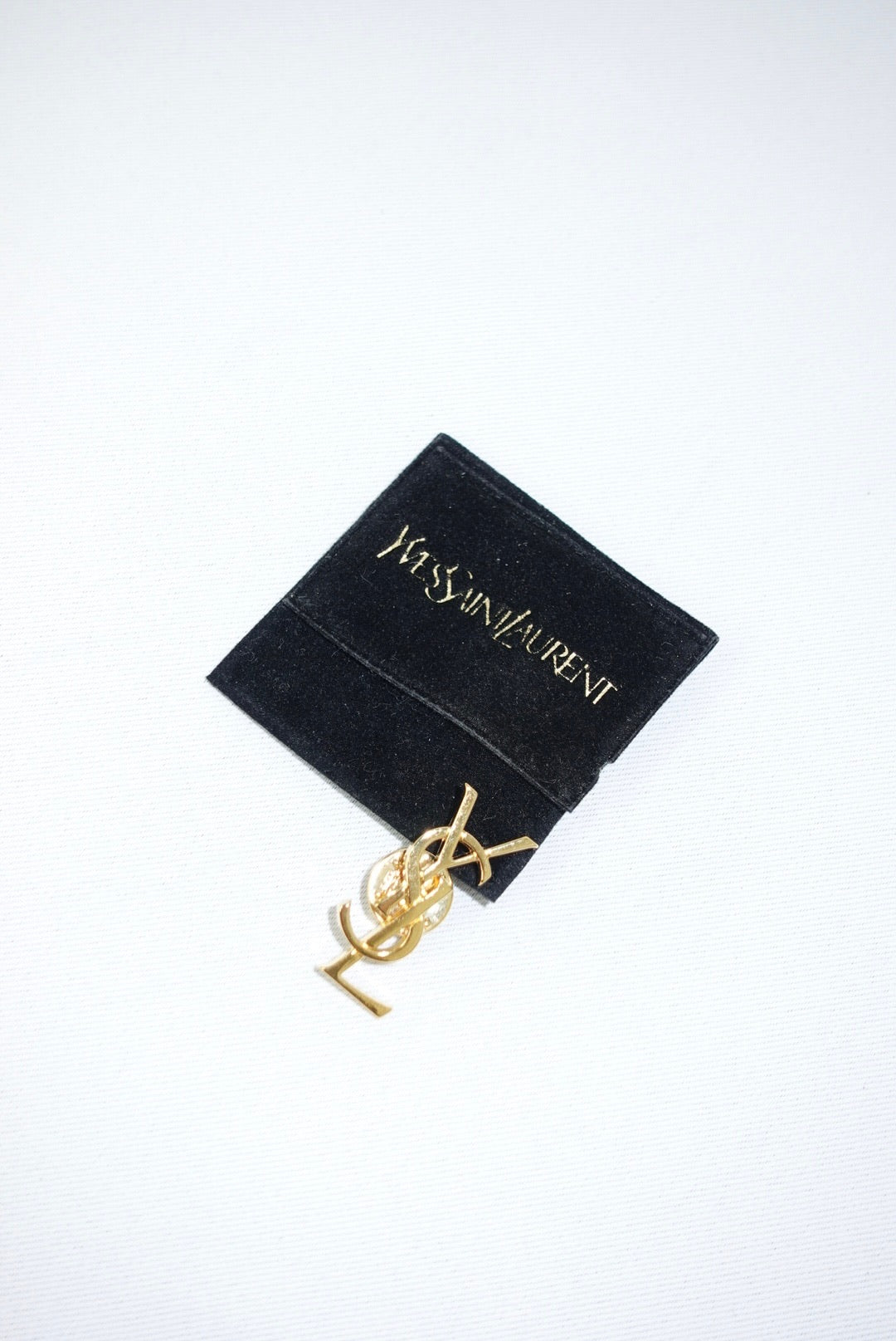 140. Yves Saint Laurent Vintage Logo Pin