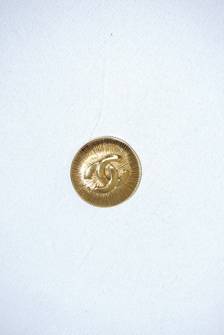 146. Chanel Vintage Clip Gold-Toned Round Logo Brooch