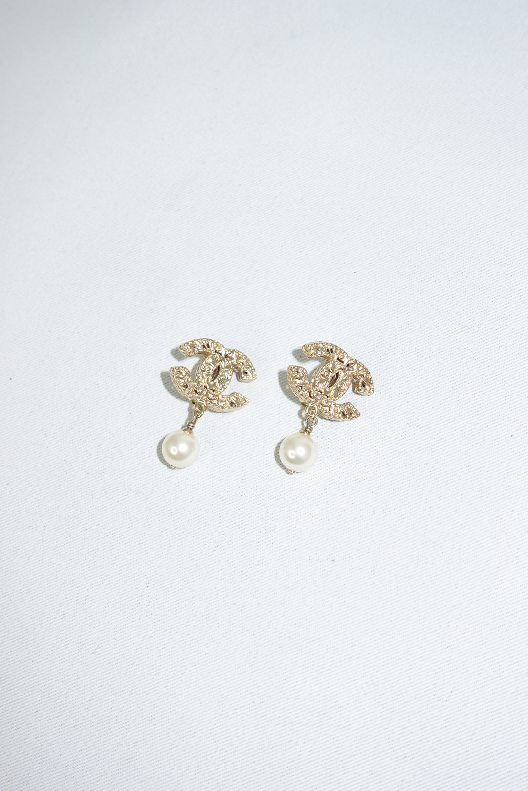 147. Chanel Vintage Gold Toned Logo Pendant Pearl Clip Earrings