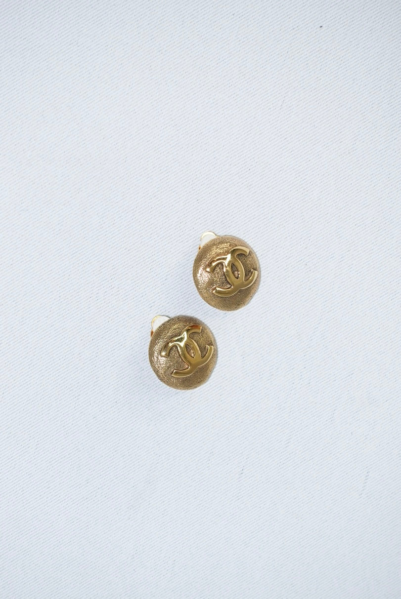 144. Chanel Vintage Clip Gold-Toned Round Logo Earrings