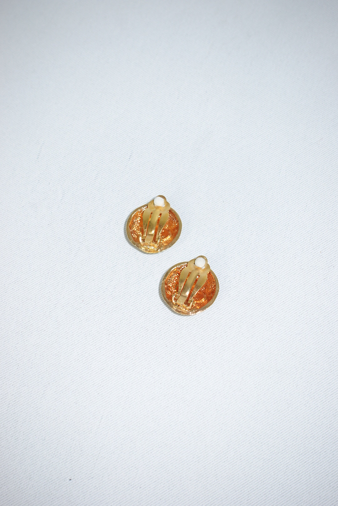 144. Chanel Vintage Clip Gold-Toned Round Logo Earrings