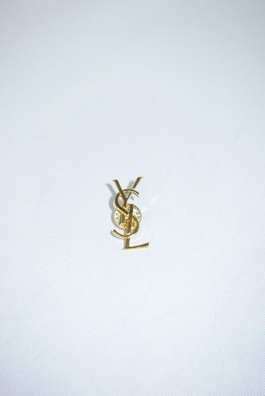 140. Yves Saint Laurent Vintage Logo Pin
