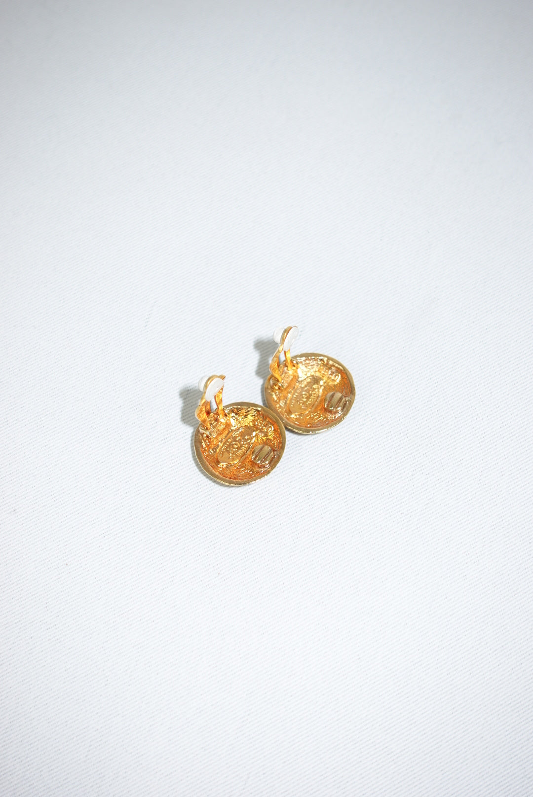 144. Chanel Vintage Clip Gold-Toned Round Logo Earrings