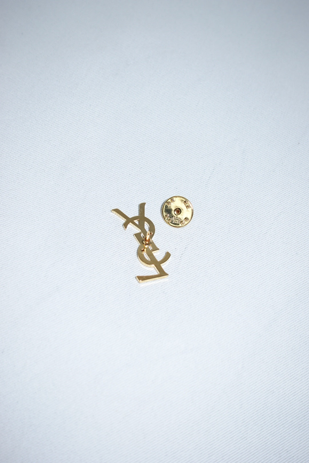 140. Yves Saint Laurent Vintage Logo Pin