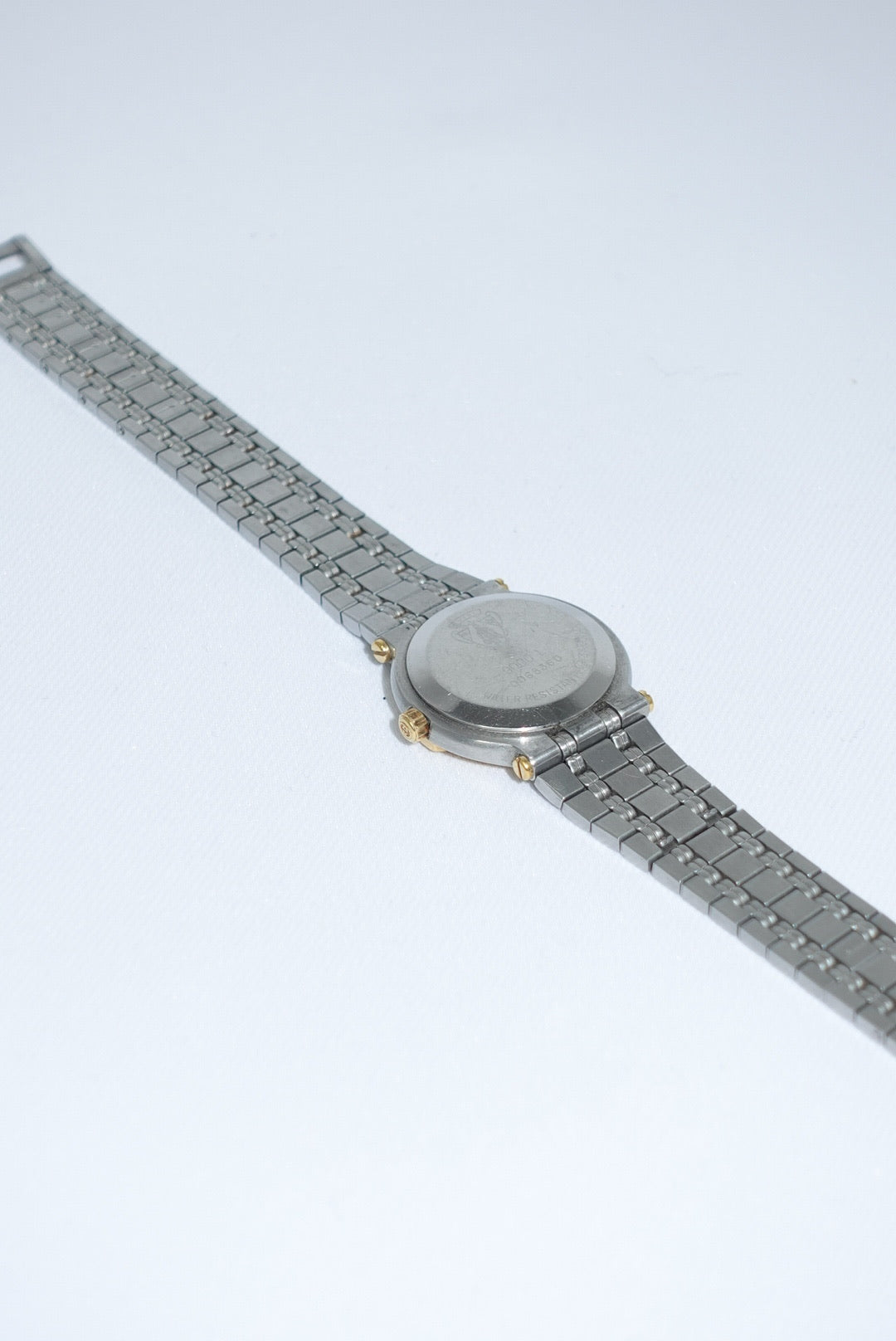 100. Gucci Vintage Silver Toned 9000L Quartz Ivory Dial Vintage Watch