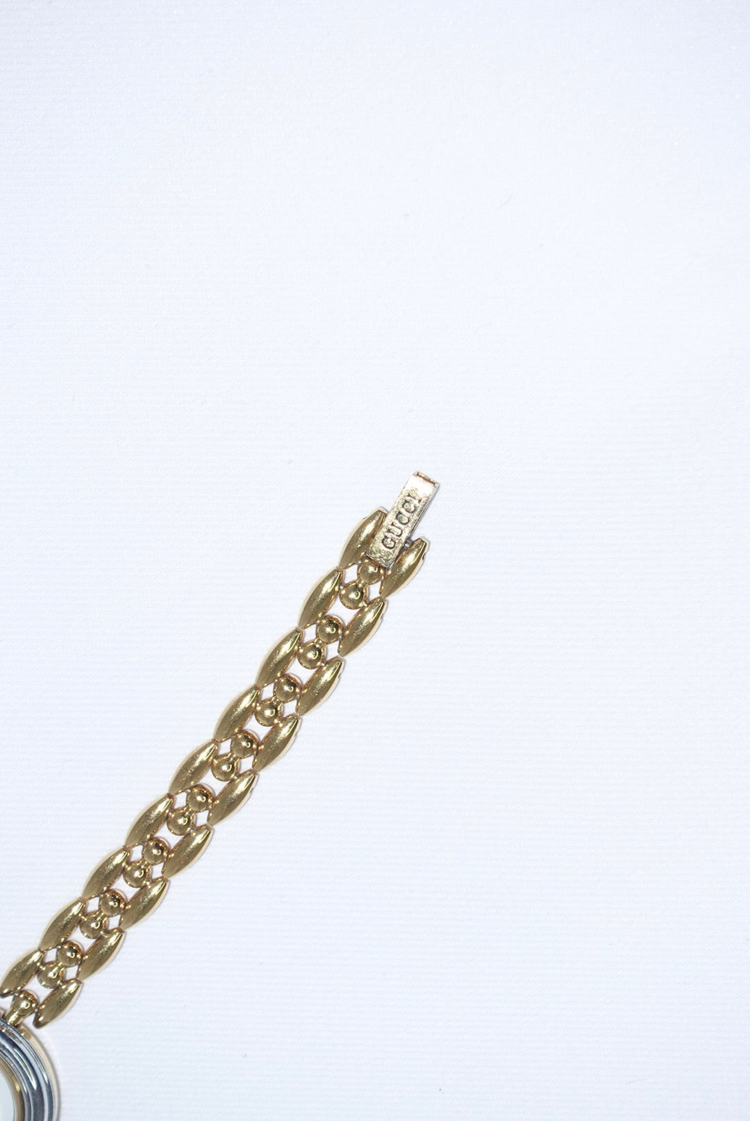 102. Gucci Bezel Gold Vintage Watch