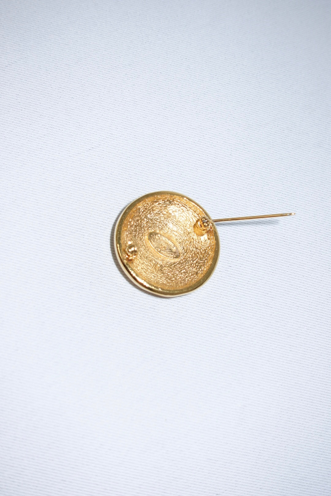 146. Chanel Vintage Clip Gold-Toned Round Logo Brooch