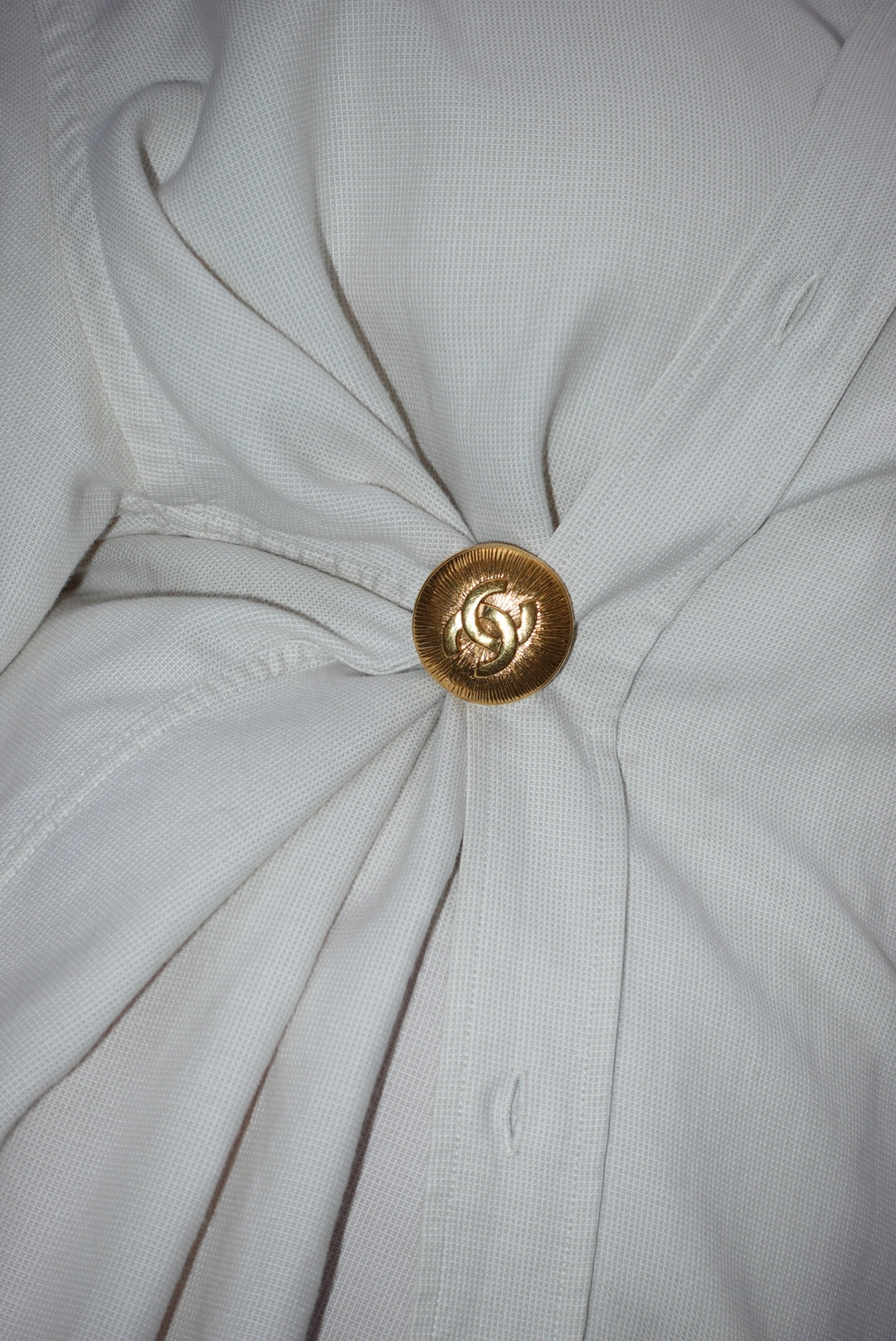 146. Chanel Vintage Clip Gold-Toned Round Logo Brooch