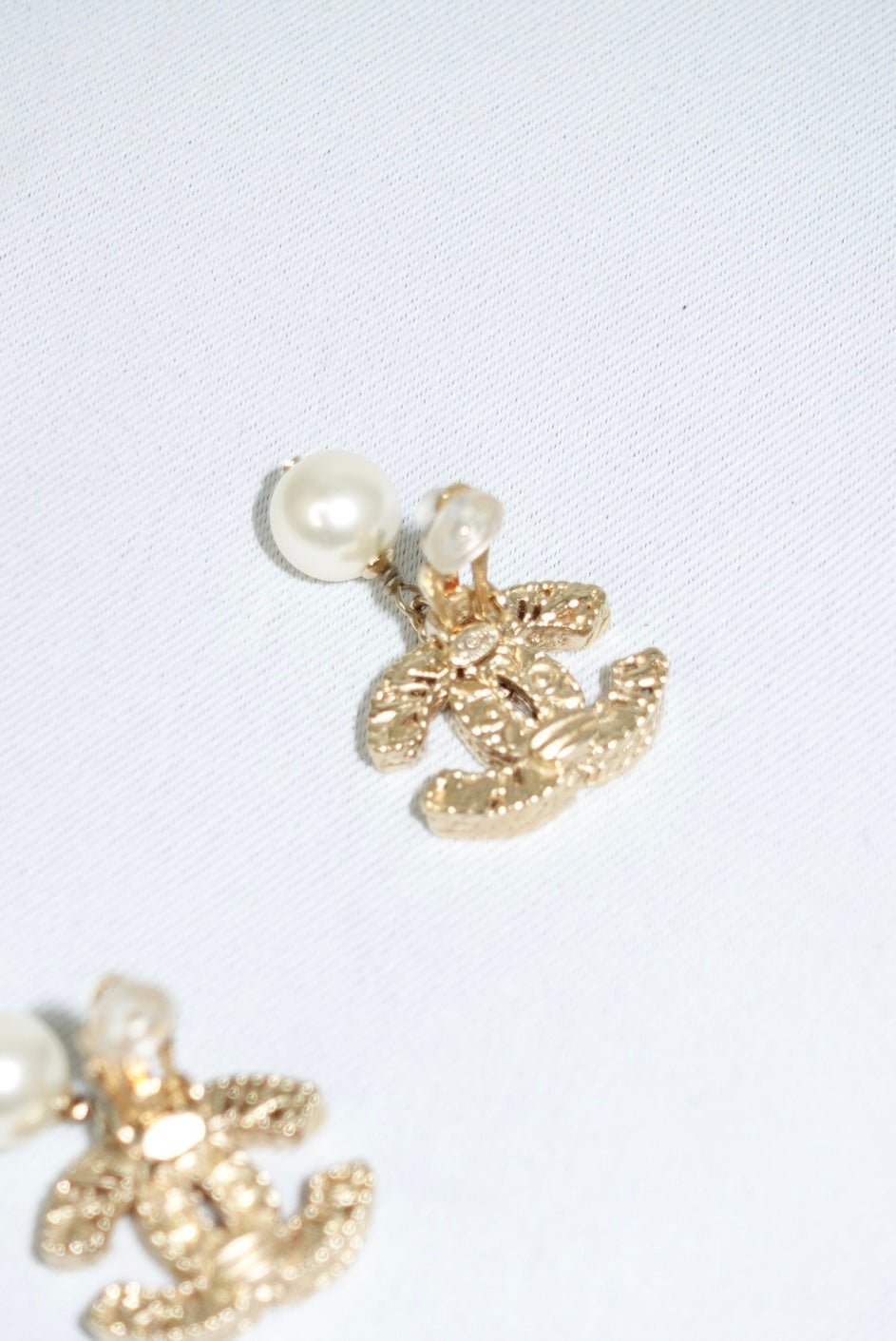147. Chanel Vintage Gold Toned Logo Pendant Pearl Clip Earrings