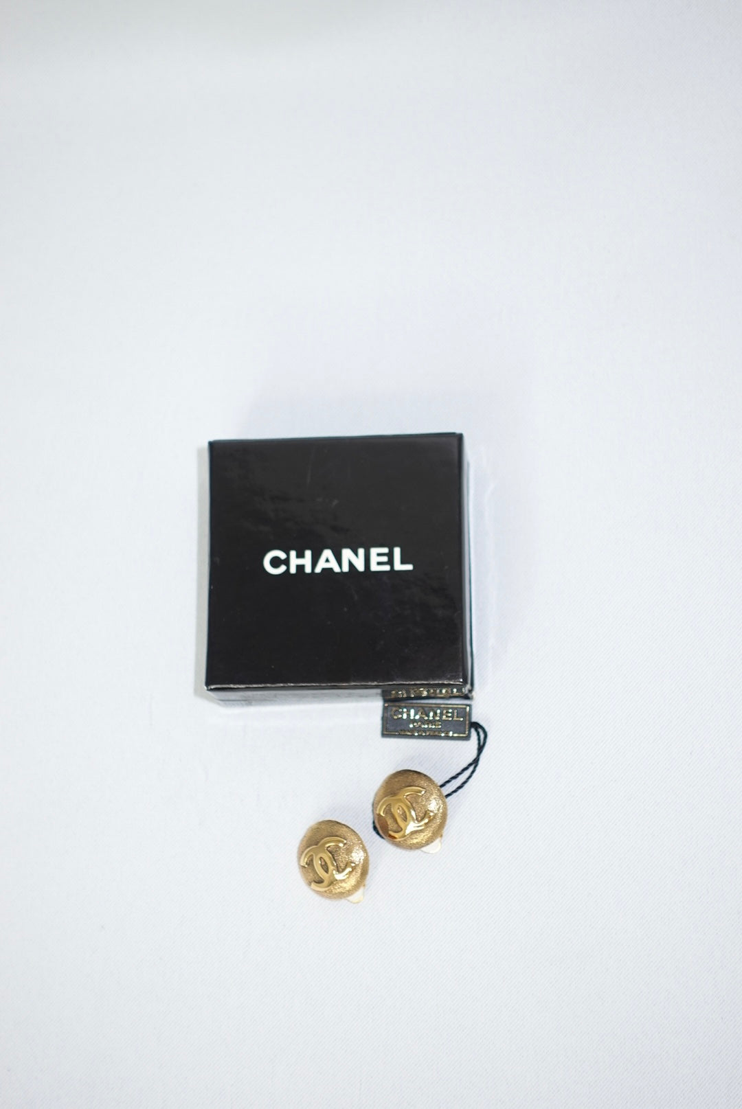 144. Chanel Vintage Clip Gold-Toned Round Logo Earrings