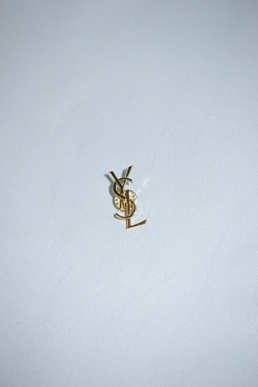 140. Yves Saint Laurent Vintage Logo Pin