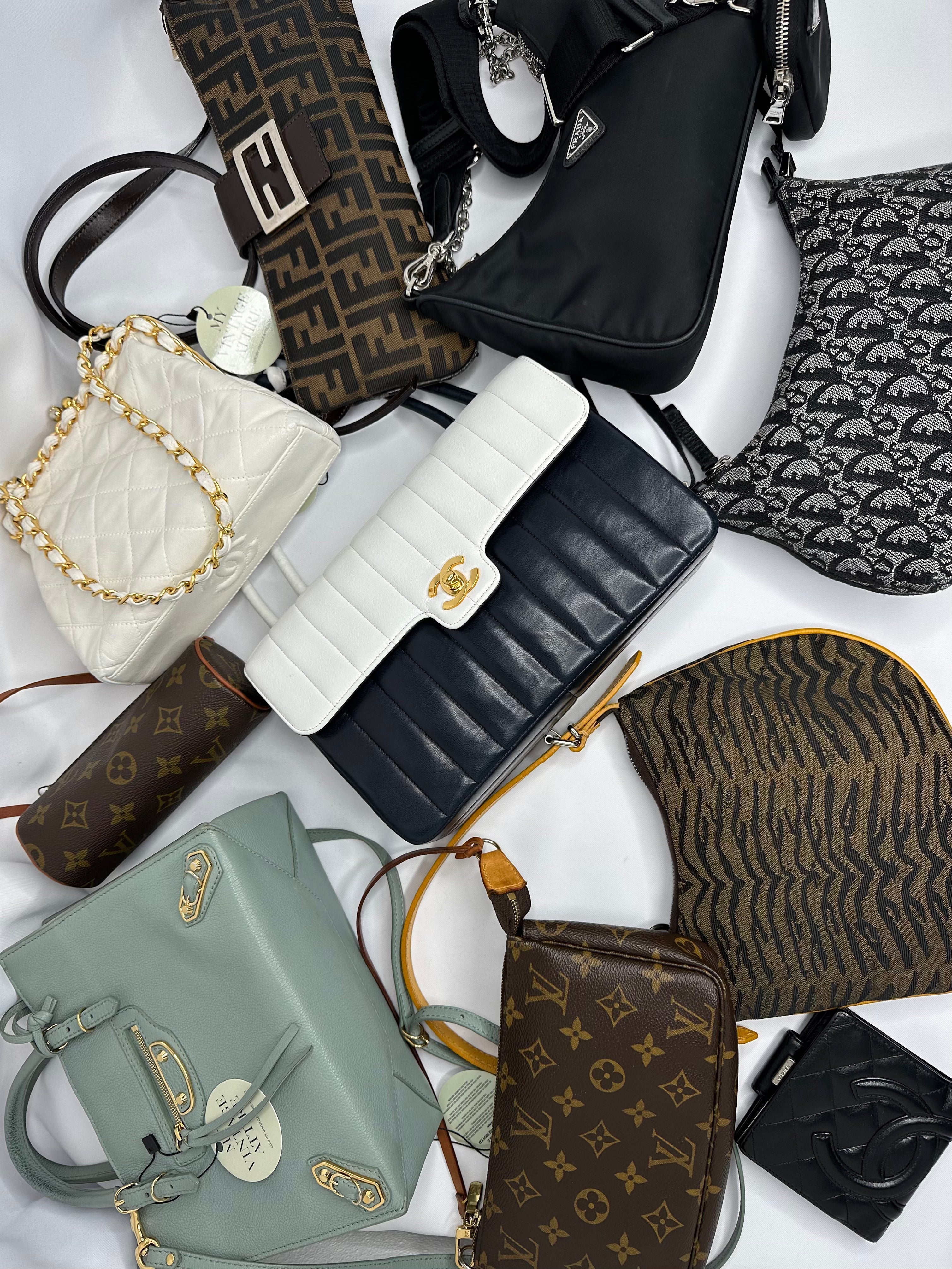 Website banner showing new luxury fashion arrivals, featuring handbags, shoes, and accessories.