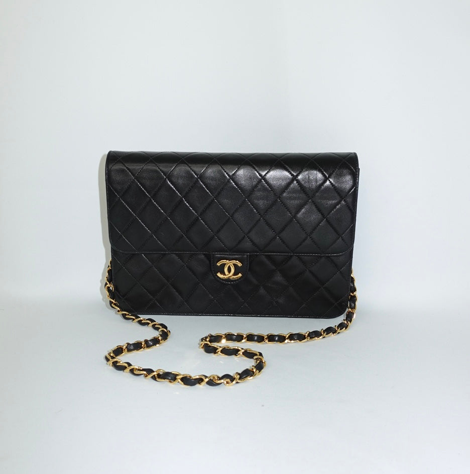 Vintage Chanel black lambskin single flap shoulder bag with gold CC logo