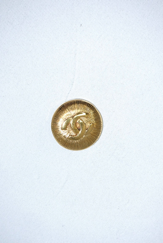 146. Chanel Vintage Clip Gold-Toned Round Logo Brooch