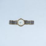     Classic Omega De Ville quartz watch in silver and gold with a round white dial.