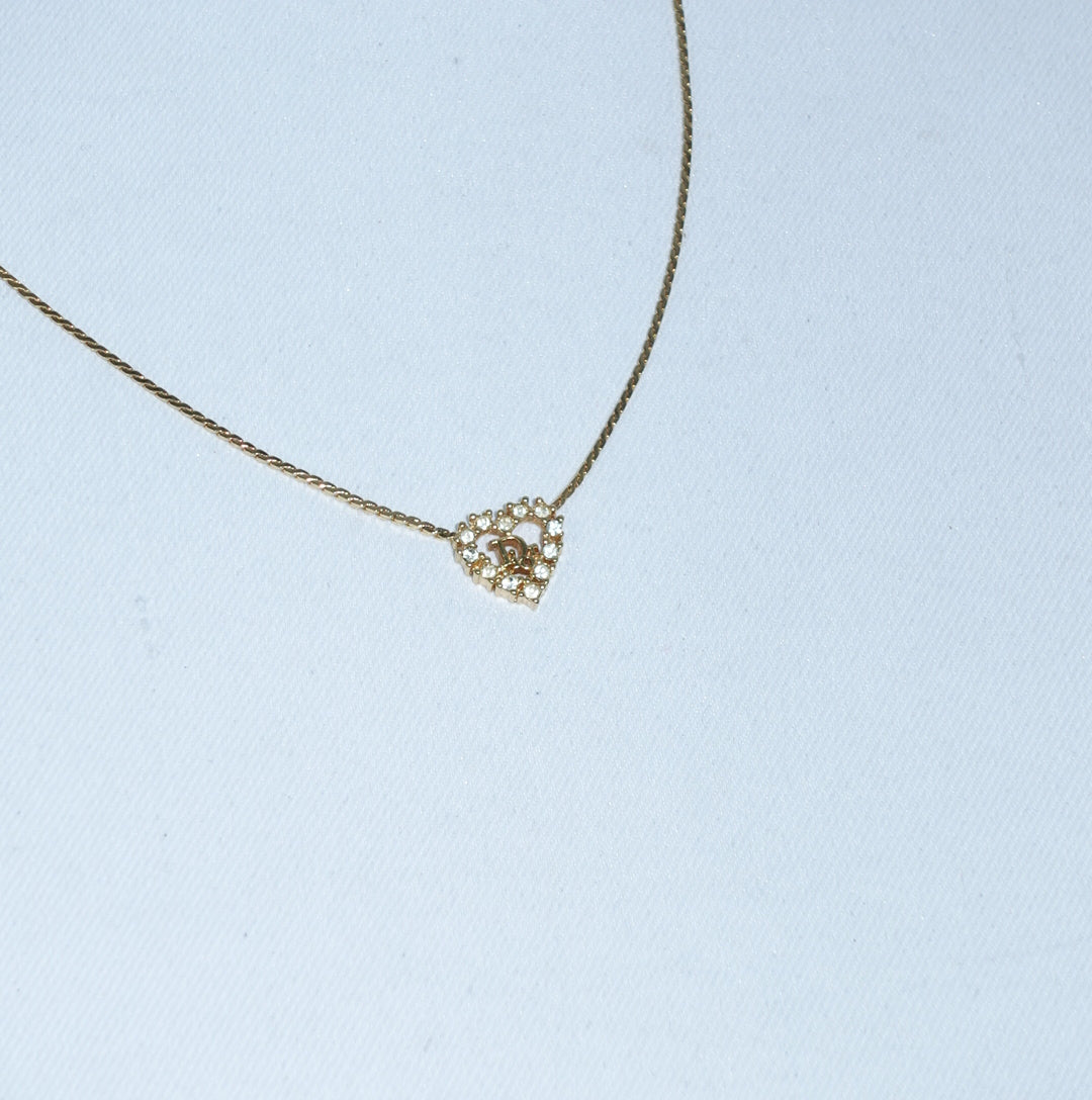     Christian Dior vintage gold necklace featuring crystal heart pendant
