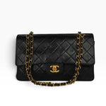 Chanel Vintage Timeless Classic 25 Double Flap Bag in black quilted lambskin leather with iconic CC turn-lock closure and 24k gold-plated hardware.