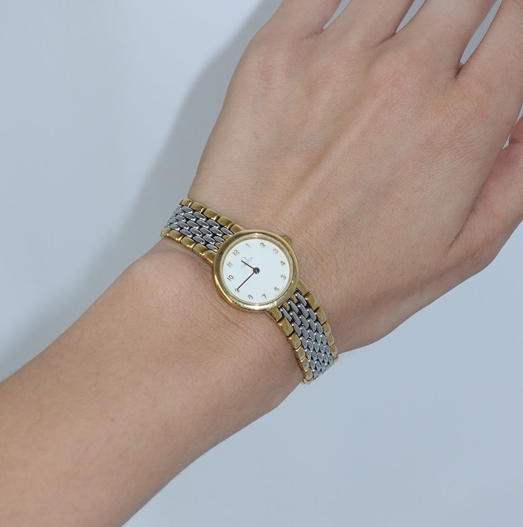     Elegant Omega De Ville watch featuring a white dial and two-tone stainless steel bracelet.