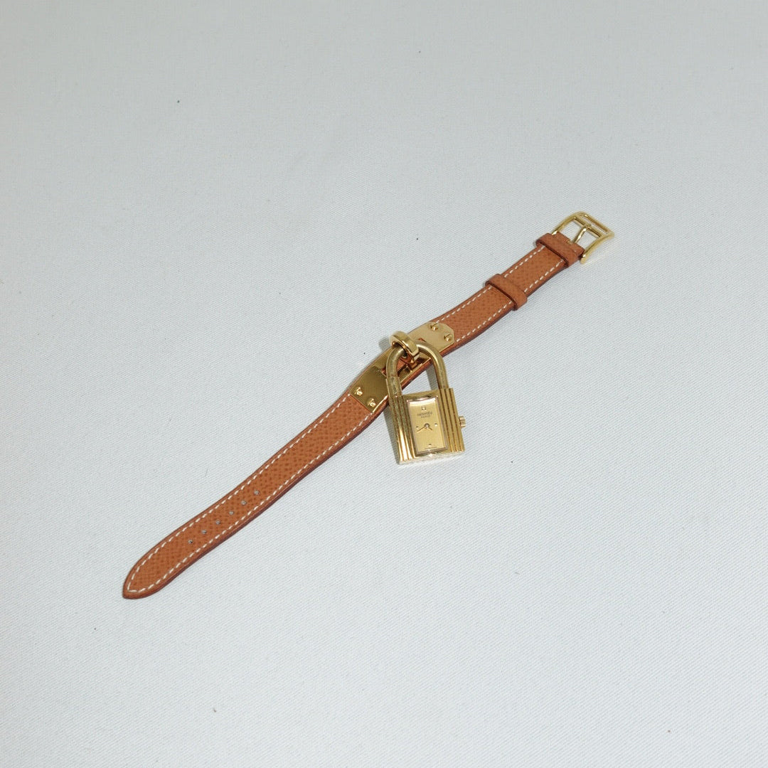 Orologio vintage Hermès Kelly con cinturino color cammello