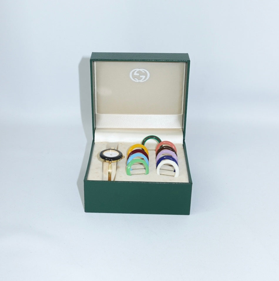     Vintage Gucci gold bezel watch with interchangeable colored bezels