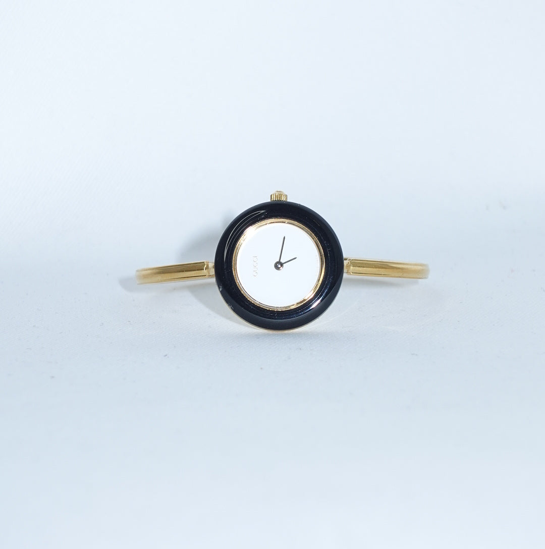     Gucci vintage gold watch with colorful interchangeable bezels