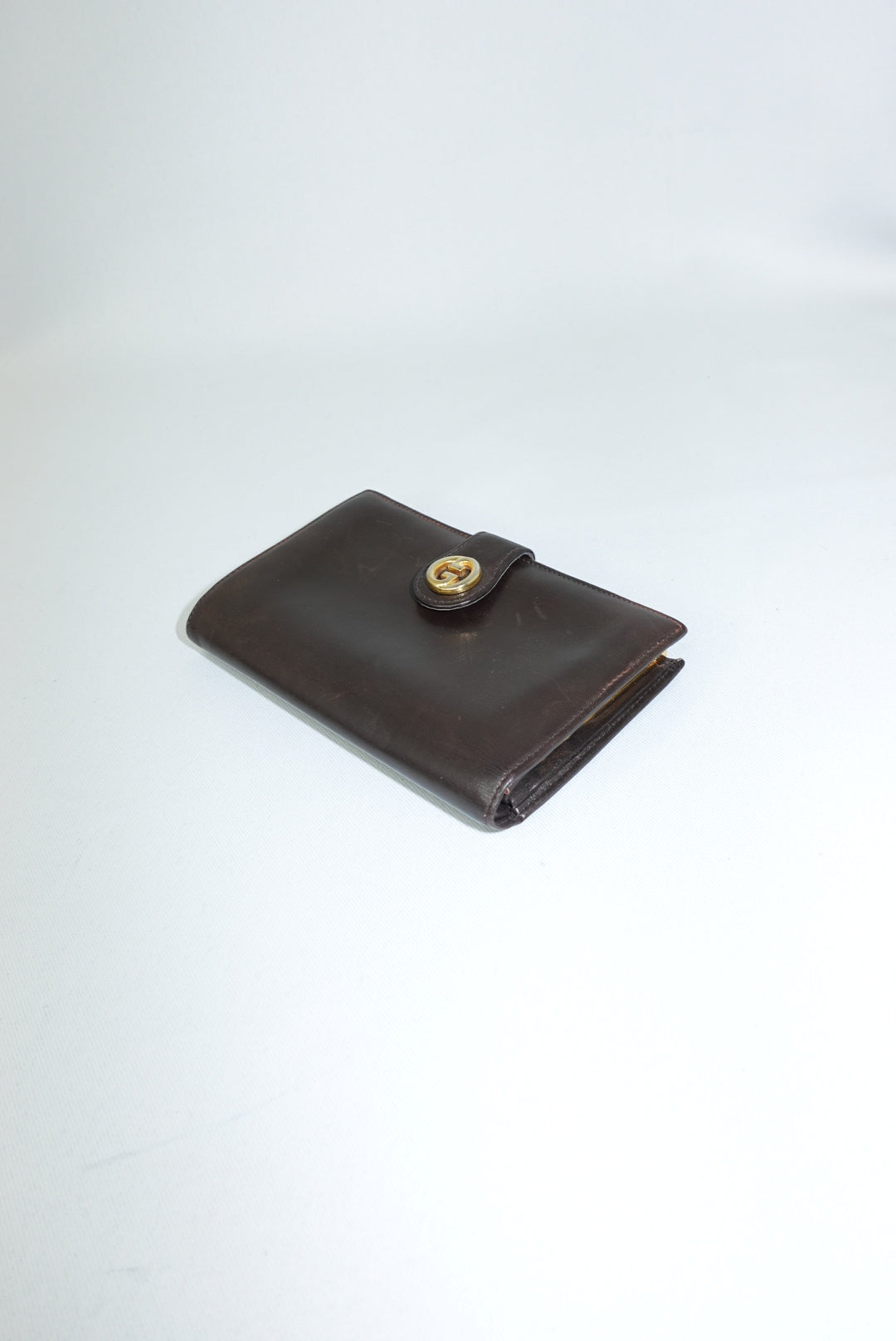 Portafoglio Gucci Vintage Medium in marrone cioccolato con logo GG color oro