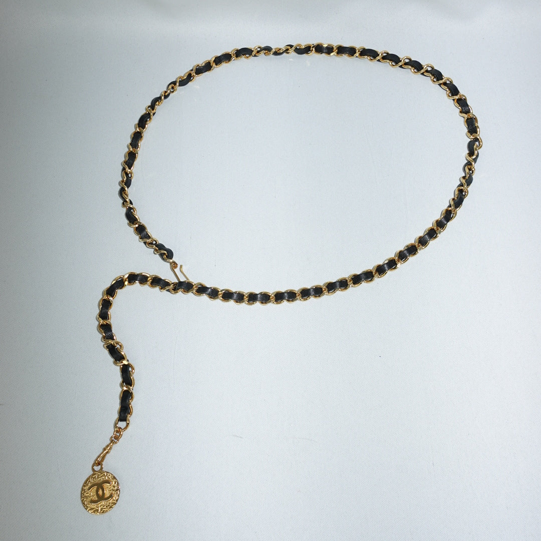 Chanel gold chain belt with black leather and medallion charm