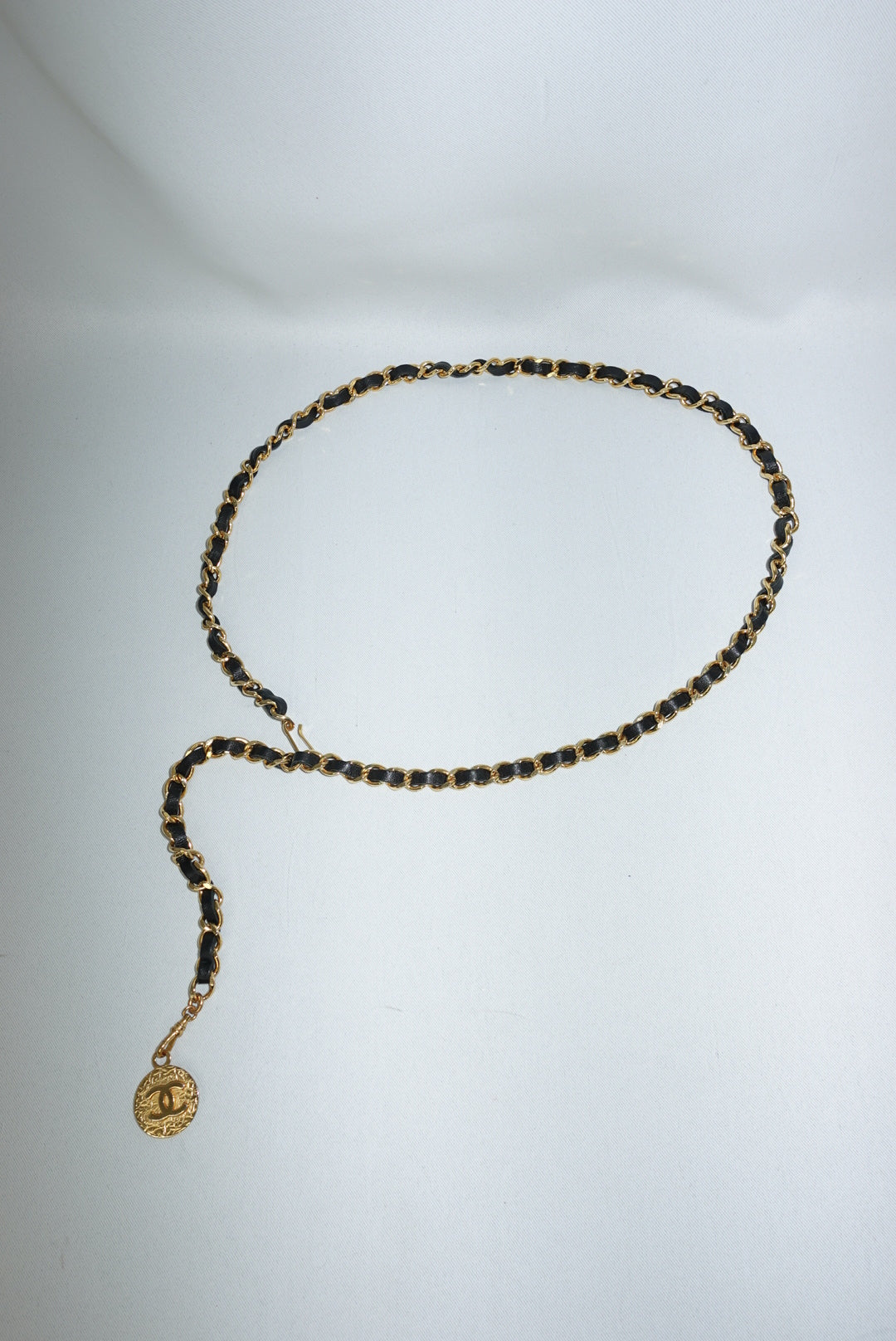 Chanel gold chain belt with black leather and medallion charm