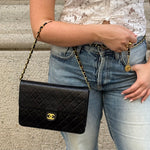 Chanel black quilted lambskin flap bag with gold-tone chain shoulder strap
