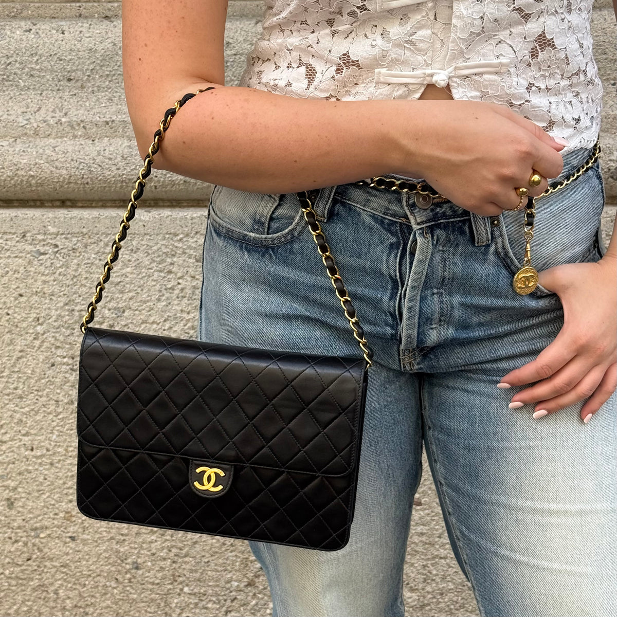 Chanel black quilted lambskin flap bag with gold-tone chain shoulder strap