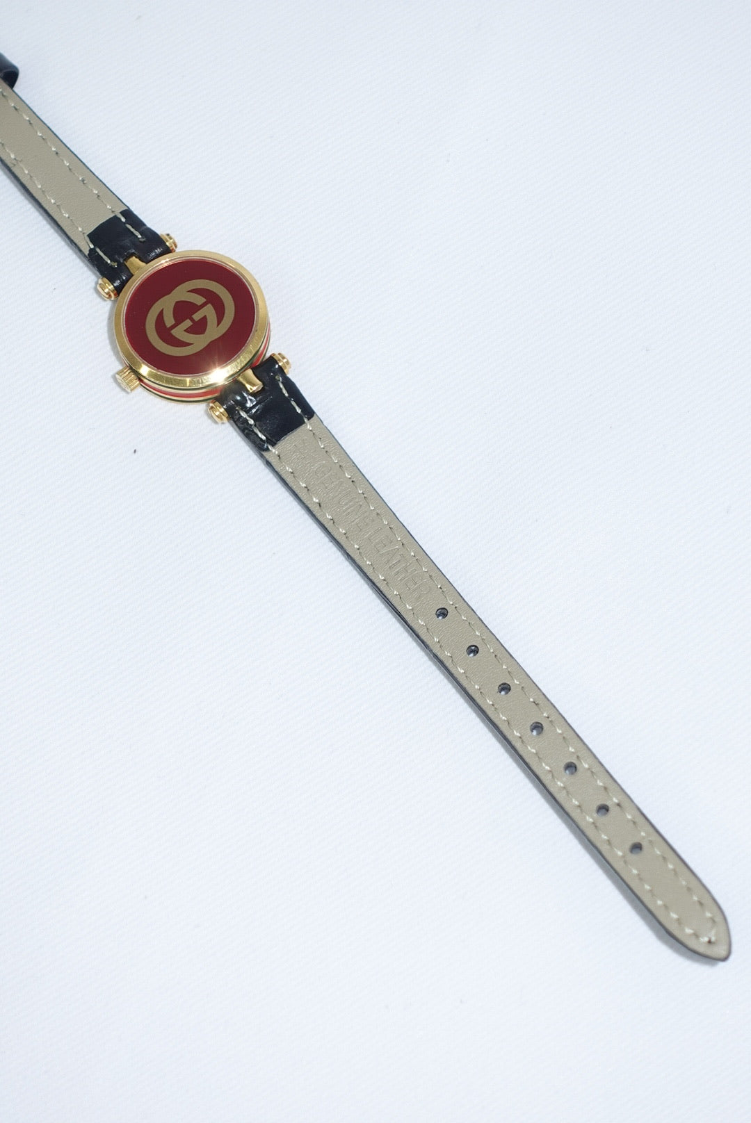104. Gucci Vintage Black Leather Strap Gold Shelly Line Watch
