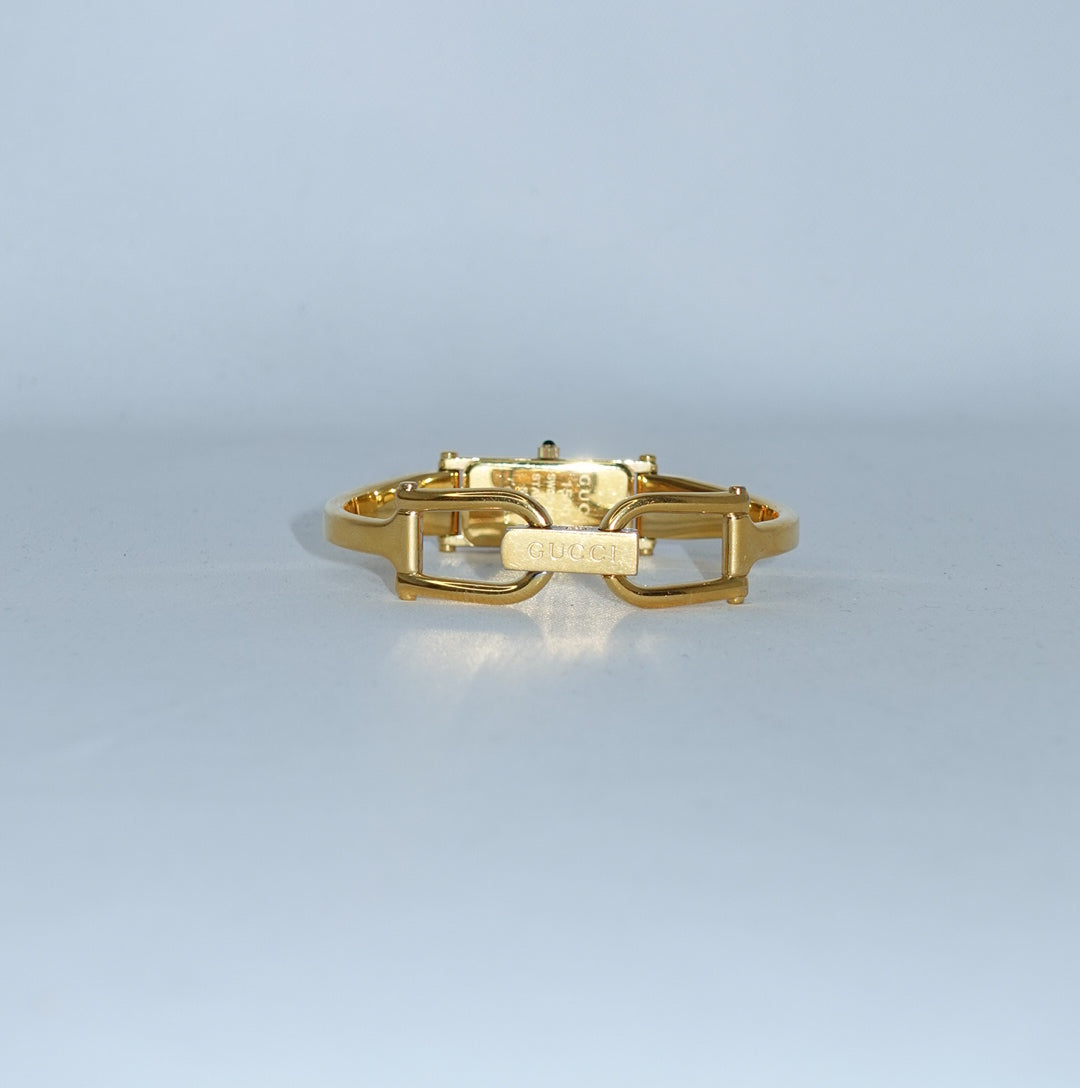 Classic Gucci quartz watch in gold-tone stainless steel with a sleek gold dial