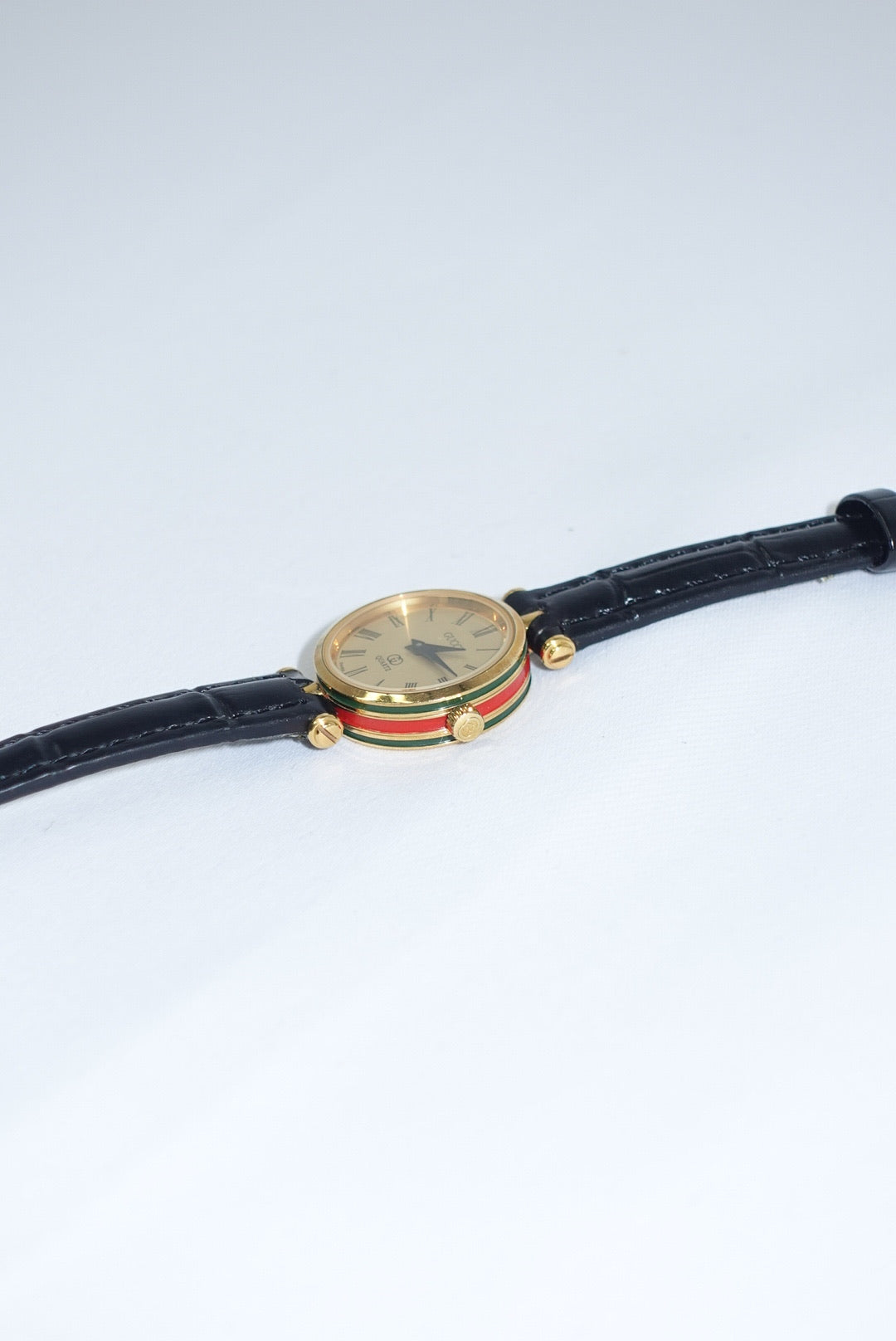 104. Gucci Vintage Black Leather Strap Gold Shelly Line Watch