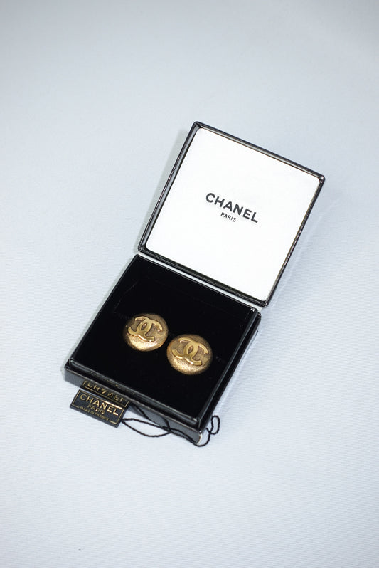 144. Chanel Vintage Clip Gold-Toned Round Logo Earrings