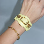 Designer Balenciaga yellow leather bracelet with gold hardware details