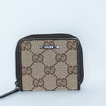 Compact Gucci GG zip coin case with logo plaque