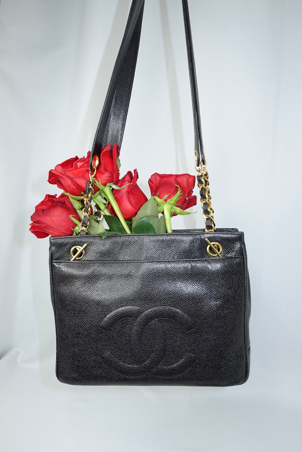 Chanel Vintage tote bag back view in black grained leather with gold hardware, structured classic shoulder silhouette