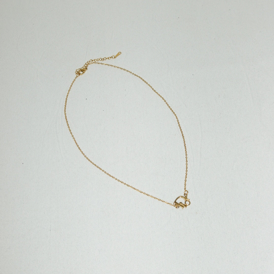Designer Dior gold tone pendant necklace with vintage element

