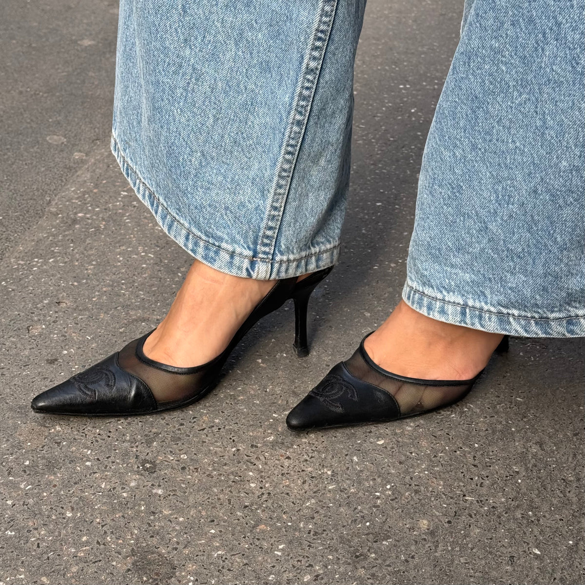 My Vintage Attire Chanel black leather and mesh slingback heels with pointed toe and embossed CC logo.