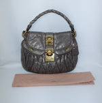 Miu Miu vintage grey Matelassé Coffer shoulder bag with quilted design and signature hardware