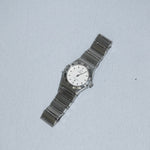 Side case detail of Omega Constellation Mini vintage watch showing stainless steel silver toned finish