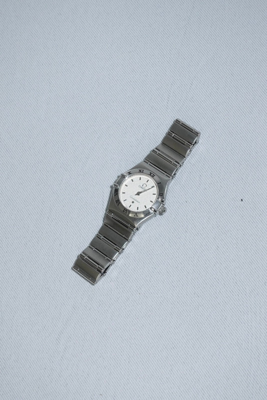 Side case detail of Omega Constellation Mini vintage watch showing stainless steel silver toned finish