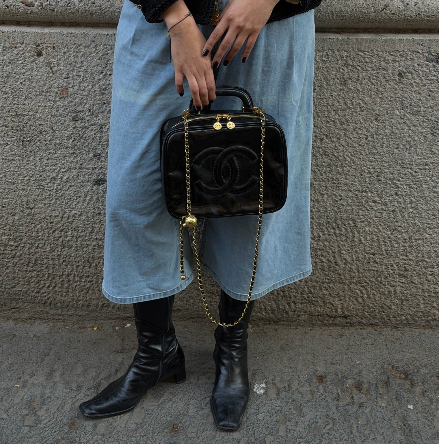 Chanel black patent leather vanity bag worn 