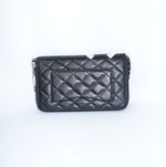 Back view of Chanel Cambon reworked wallet on chain in black leather with added silver chain strap.
