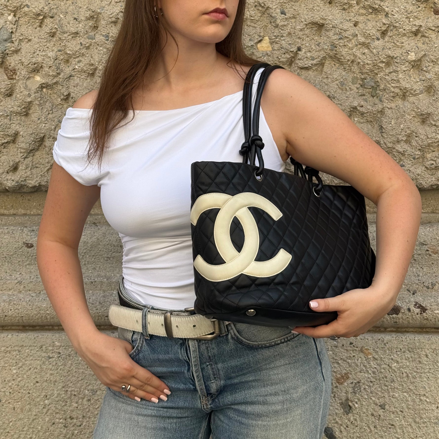     Chanel Cambon Tote Bag worn side view showing bag shape and handles