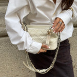 Chanel Gabrielle white leather Hobo Bag worn by model showing size, shape and signature chain detailing