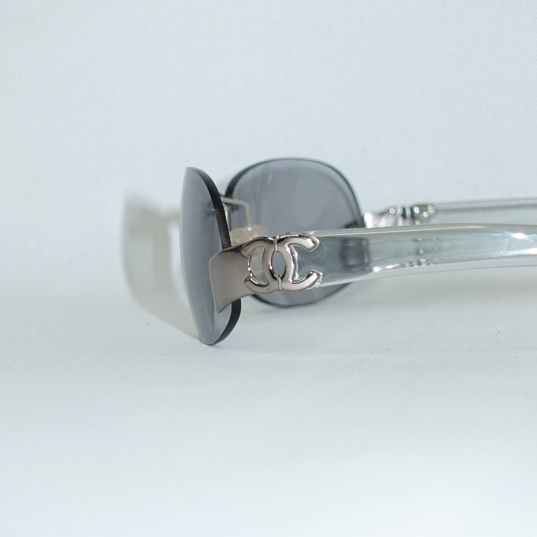 Chanel rimless oval sunglasses logo detail silver frame