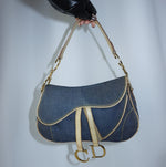 Dior Denim Double Saddle Bag in blue denim with beige leather trim and gold-tone hardware front view