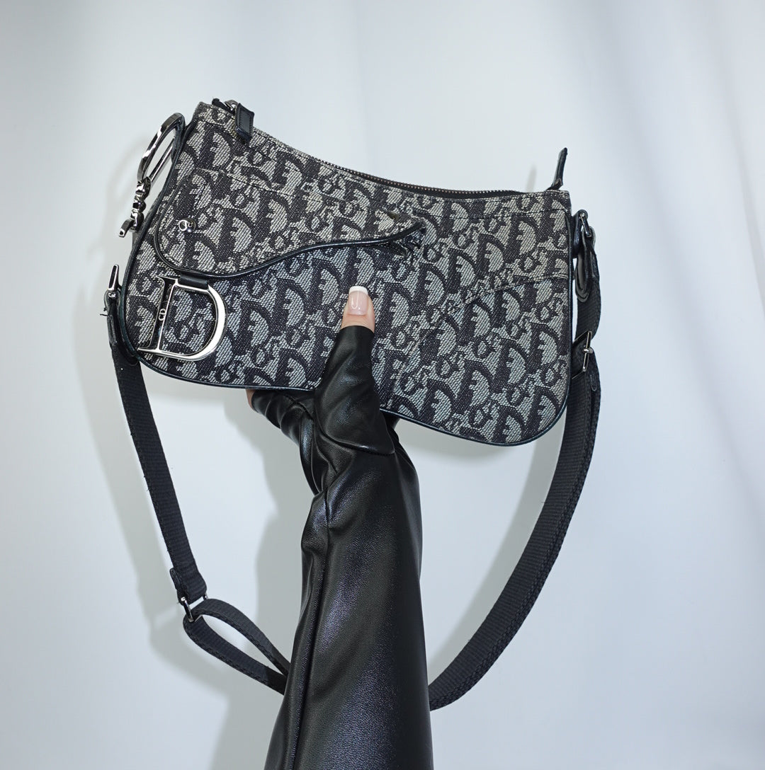     Vintage Dior Double Saddle Monogram Canvas Crossbody Bag front view with iconic logo pattern and leather trim.