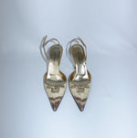 Front view of Dolce & Gabbana Gold Python Heels with pointed toe, metallic gold trim and bow detail.